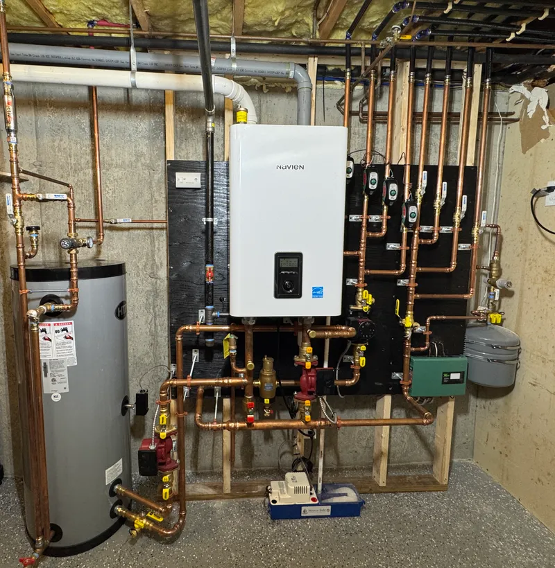 High efficiency boiler installation with air intake exhaust