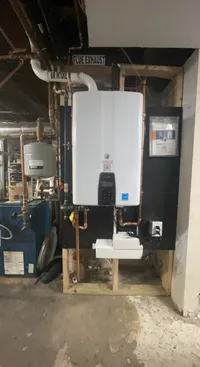 Navien tankless water heater installed with board