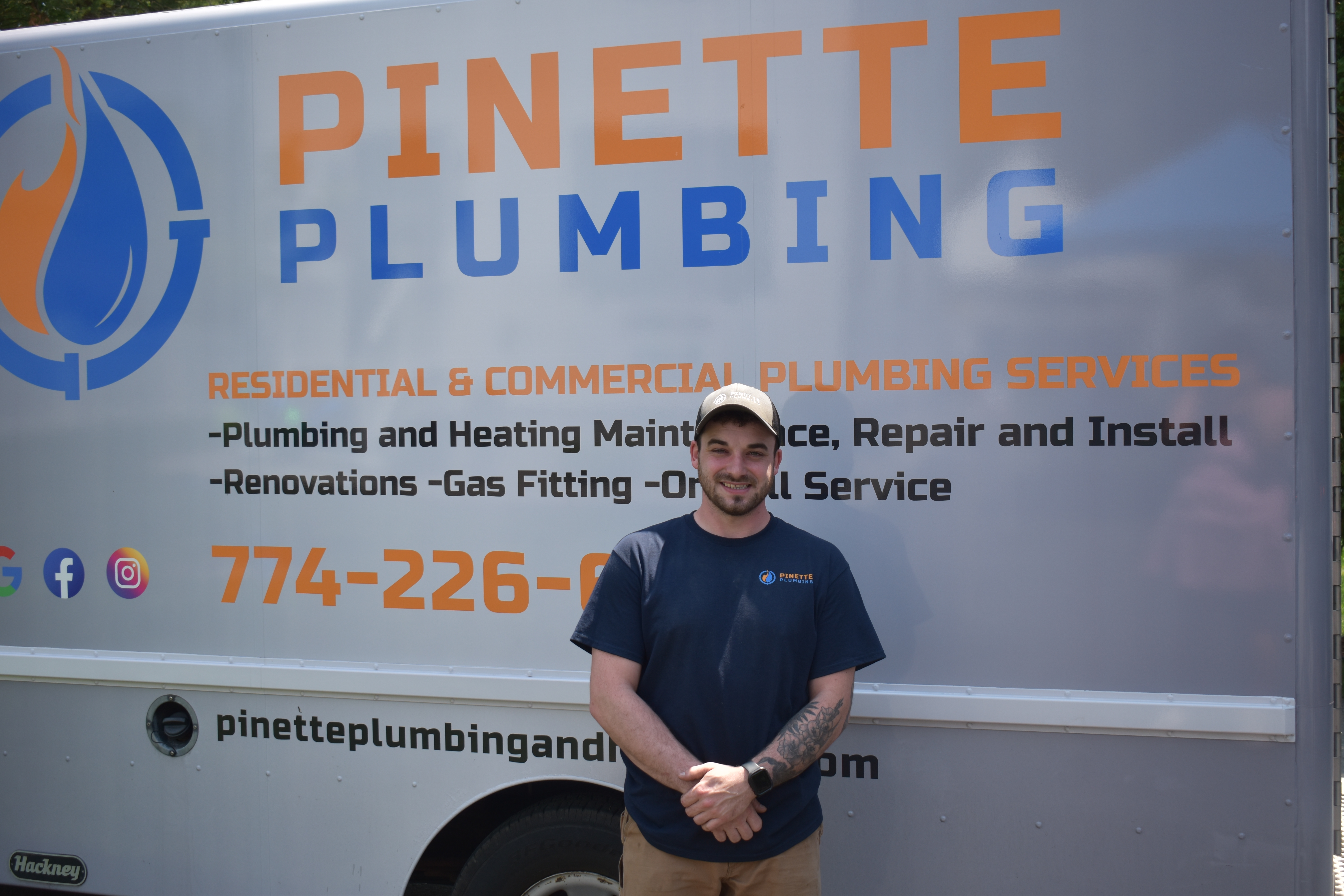 Chris Pinette in front of the lettered Pinette Plumbing van